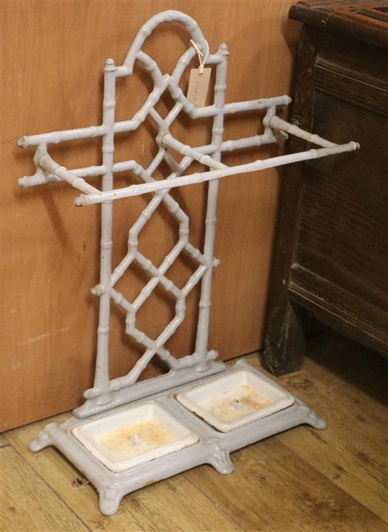 An enamelled faux bamboo cast iron stick stand W.51cm